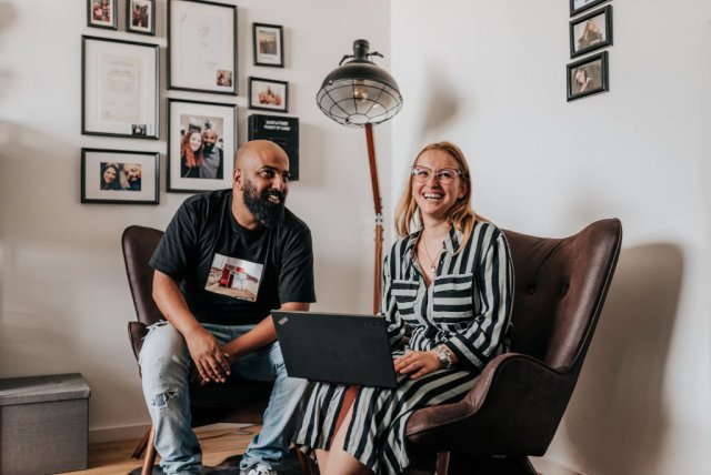 Two eSagu employees sitting at one table.